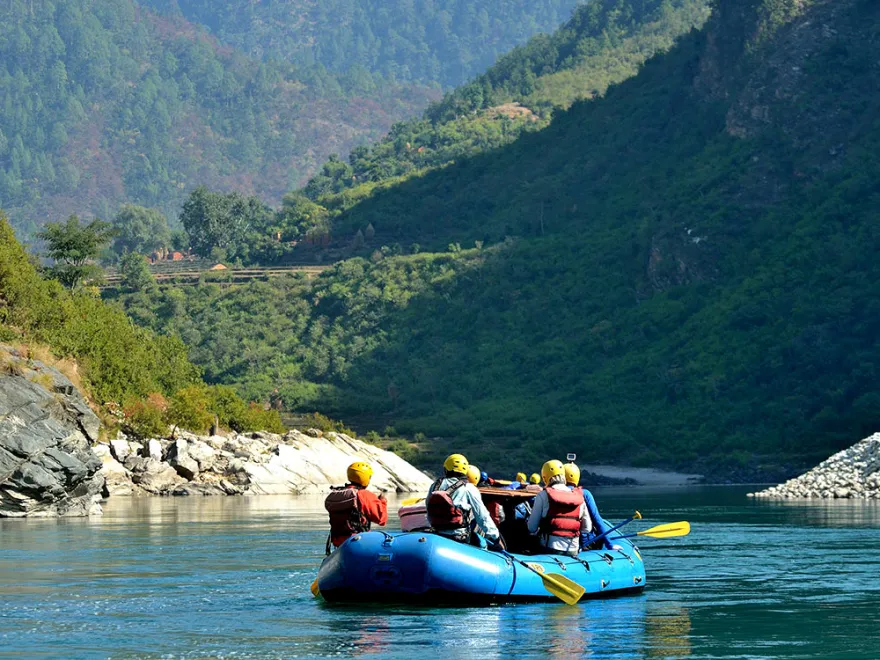 Scenic riverside fishing surrounded by Nepalese hills and forests
