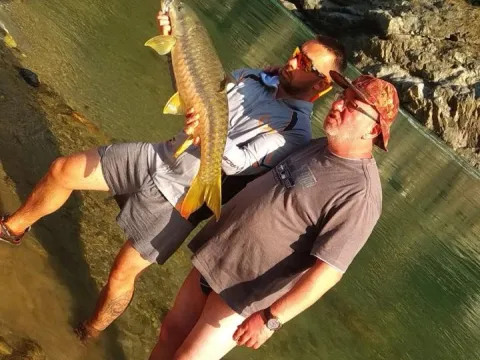 Angler enjoying a wilderness fishing experience in Nepal