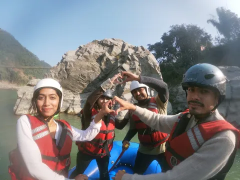 Rafting group paddling through whitewater rapids on the Bhotekoshi River