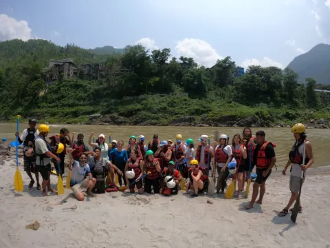 Happy rafting group celebrating after completing their Bhotekoshi River adventure