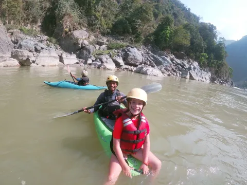 Family enjoying a peaceful riverside break during a Lower Seti rafting trip
