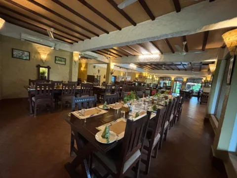 Cozy dining area serving meals during a Chitwan safari stay