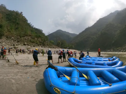 Scenic Karnali River surrounded by lush forests and rugged Himalayan terrain