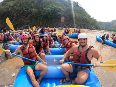 Trishuli River rafting with scenic hills, villages, and riverside landscapes