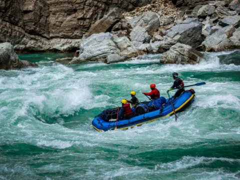 Experienced kayaker navigating powerful whitewater rapids on the Karnali River in Nepal