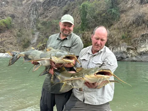 Angler casting for Golden Mahseer along the Karnali River