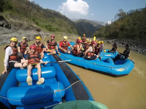 Budhi Gandaki Rafting team guiding guests through Trishuli River rapids