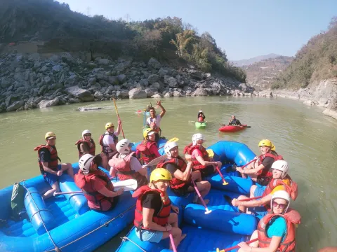 Trishuli River rafting adventure surrounded by Nepal's green hills